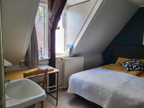 Ένα ή περισσότερα κρεβάτια σε δωμάτιο στο Chambre d'hote à Middelburg
