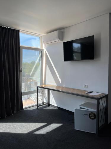 a desk in a room with a large window at Дача in Kryvyi Rih