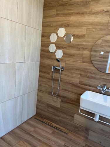 a bathroom with a shower and a sink at Дача in Kryvyi Rih