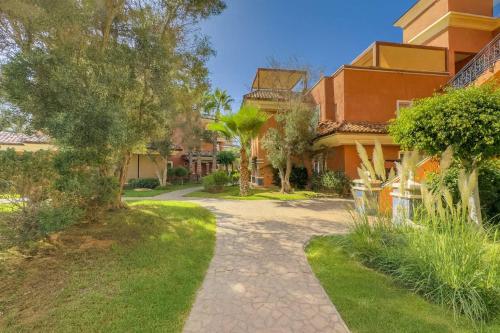 a walkway in front of a house at Penthouse d'Exception, Terrasse et Piscine Privée in Bouznika