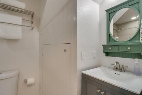 a bathroom with a green mirror and a sink at Private Deck Secluded Fairplay Cabin in Fairplay