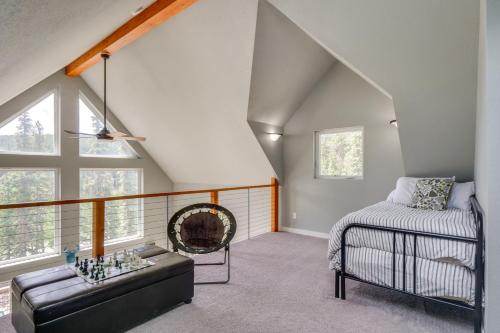 a attic room with a couch and a bed at Private Deck Secluded Fairplay Cabin in Fairplay