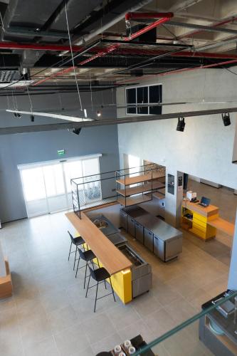 a large room with a table and chairs in it at ibis Arcoverde in Arcoverde