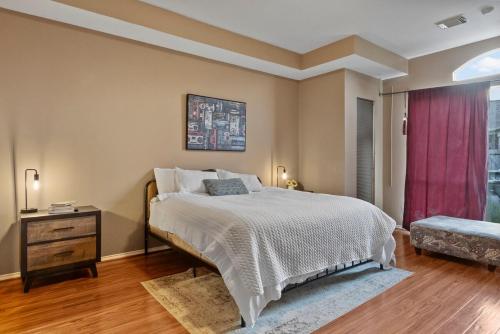a bedroom with a large bed and a window at Spacious Retreat for Crews, Corporates & Families in Houston
