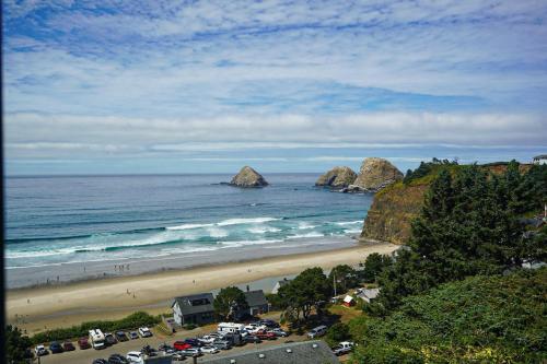 a view of a beach with cars parked on it at Berni's Ocean View Castle - The Potter's Wheel in Oceanside