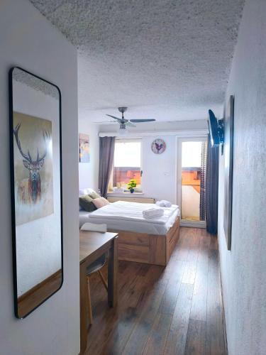 Ένα ή περισσότερα κρεβάτια σε δωμάτιο στο PAVLIN Bed & Breakfast