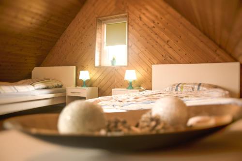 a bedroom with a bed and a bowl of food at Unterkunft4You-Ferienhaus-Zum-Burgfried in Usingen