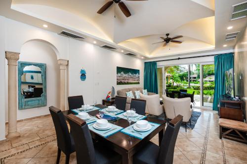 a dining room with a table and chairs at Matapalo Diria 103 - Luxury 2BR Pool & Beachside in Tamarindo