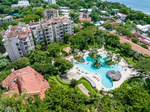 an aerial view of a resort with a swimming pool at Matapalo Diria 103 - Luxury 2BR Pool & Beachside in Tamarindo