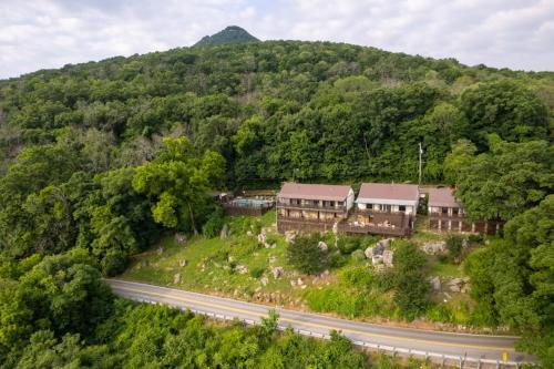 an aerial view of a house on a hill with a road at Historic Riverview Inn Three in Chattanooga