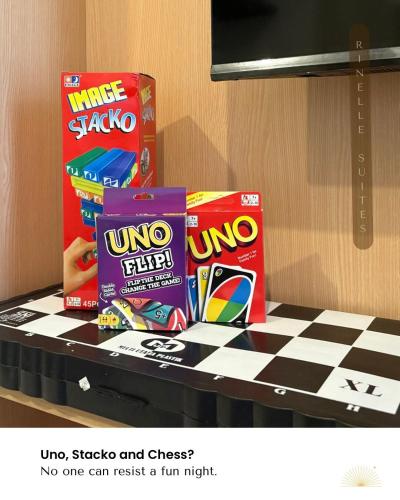 a counter with some snacks on top of a counter at Stylish 2BR Apt at PIK 2 Rinelle in Muara