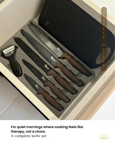 a set of tongs in a drawer with a knife set at Stylish 2BR Apt at PIK 2 Rinelle in Muara