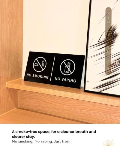 a sign that says no smoking on a shelf at Stylish 2BR Apt at PIK 2 Rinelle in Muara