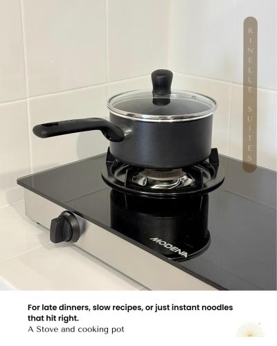 a pot on top of a stove in a kitchen at Stylish 2BR Apt at PIK 2 Rinelle in Muara