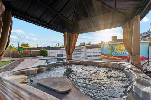 a hot tub in the backyard of a house at Relaxing Casita - Pool - Spa - Prime Location in Phoenix