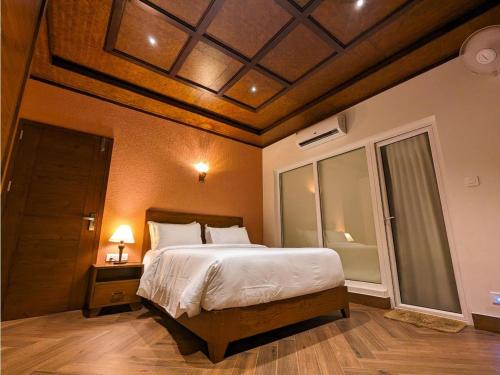 Letto o letti in una camera di Talenresort Vythiri Villas