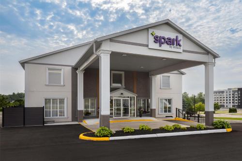 a spark building with a sign on it at Spark By Hilton Woodstock in Woodstock