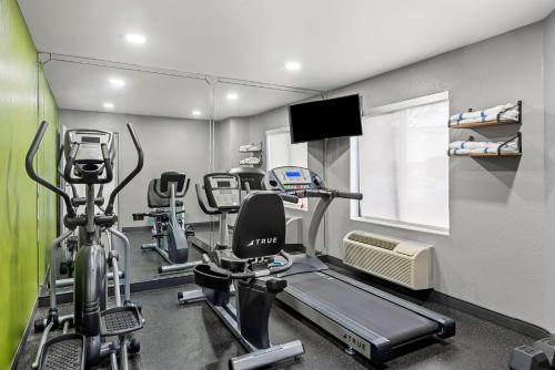 a gym with several exercise bikes in a room at Spark by Hilton Oxford in Oxford