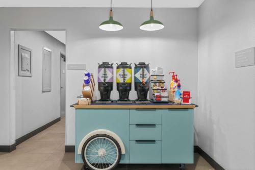 a cart in a room with boots on top of it at Spark by Hilton Colorado Springs I 25 Central in Colorado Springs