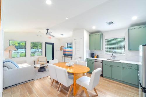 a kitchen and living room with a table and chairs at Pines & Palms Resort in Islamorada
