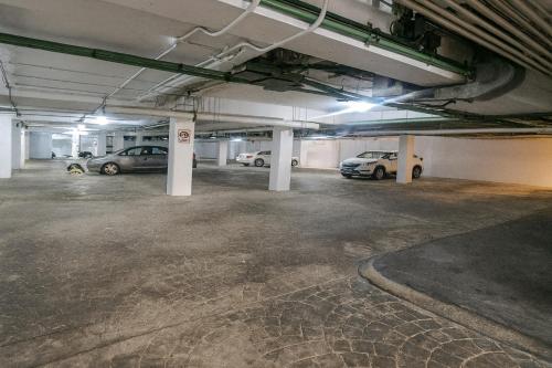 an empty parking garage with cars parked in it at Papaya 15 Apartments in Playa del Carmen