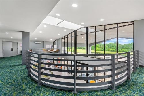 a library with a large wall of windows at Spark by Hilton Lexington Hamburg in Lexington