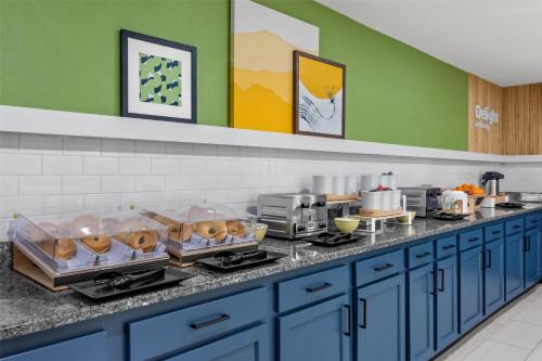 a kitchen with a counter with food on it at Spark by Hilton Lexington Hamburg in Lexington