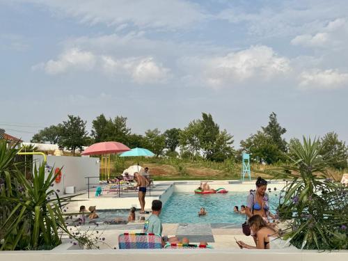 a group of people in a swimming pool at Calipo in Vila Viçosa