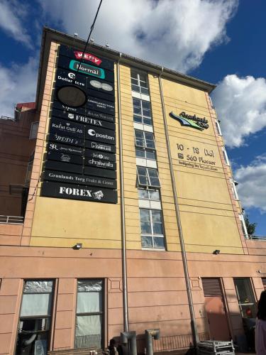 a building with a sign on the side of it at Exclusive Central-Home in Central Oslo- for five people in Oslo