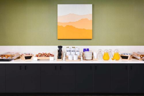 a counter with a bunch of food on it at Spark By Hilton Las Vegas Airport in Las Vegas
