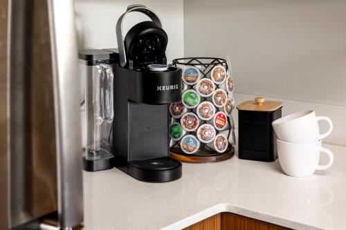 a coffee maker sitting on top of a counter at Trailside45 Modern Getaway – Traverse City in Traverse City