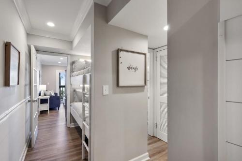 a room with a hallway with bunk beds at Unspoiled Beachfront Villa Sunrises from Balcony in Hilton Head Island