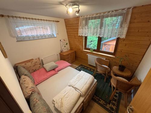 Ένα ή περισσότερα κρεβάτια σε δωμάτιο στο Ski&hike apartments Krkonoše - Janské Lázně