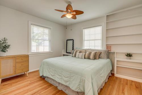 a bedroom with a bed and a ceiling fan at 4 Mi to Dtwn Jacksonville Chic Home with Porch! in Jacksonville