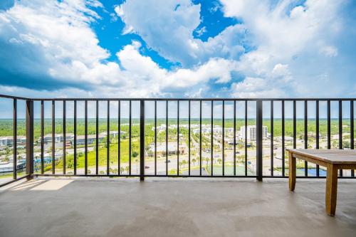 a balcony with a table and a view of the beach at Phoenix II 2151 condo in Romar Beach