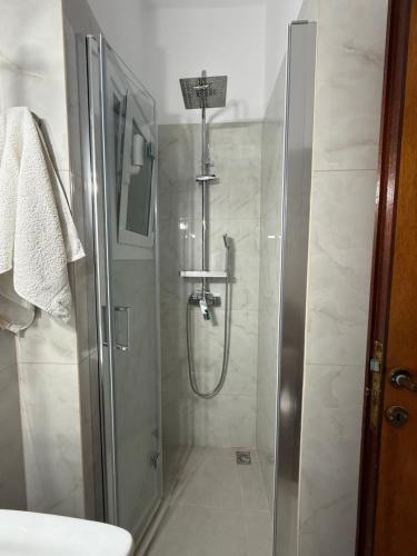 a bathroom with a shower and a sink at Paradise Garden Paros in Piso Livadi