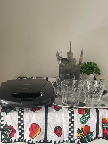 a food processor sitting on top of a table at Praia de Botafogo próximo a Copacabana in Rio de Janeiro