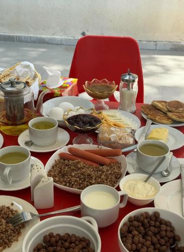 a table topped with plates of food and other foods at Noor Dilijan in Dilijan