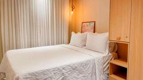 Katil atau katil-katil dalam bilik di Jardins Almare Apart Hotel
