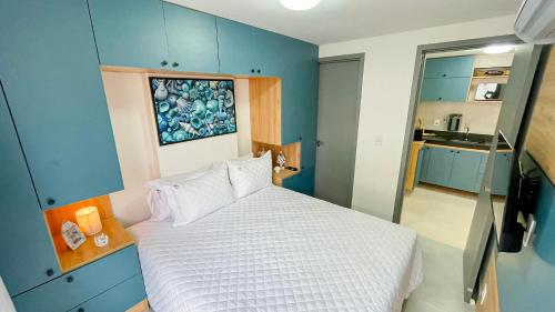 Katil atau katil-katil dalam bilik di Jardins Almare Apart Hotel
