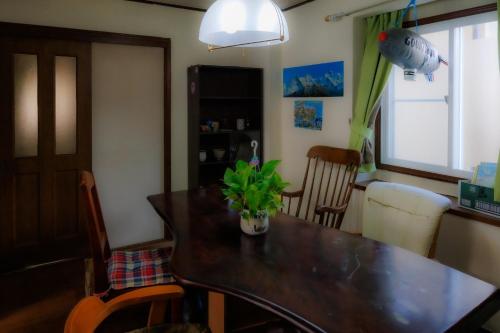 a dining room table with a potted plant on it at Ashigarashimogun - House - Vacation STAY 19326 in Mongawa