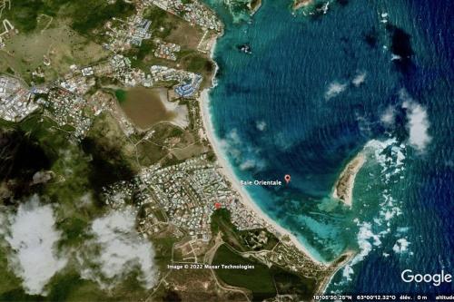 a satellite image of the shoreline of the ocean at Villa Redfish in Orient Bay