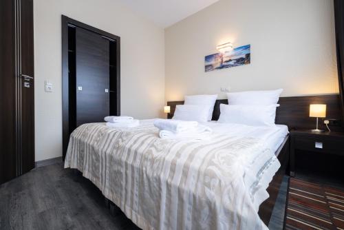 Ένα ή περισσότερα κρεβάτια σε δωμάτιο στο home Hotel