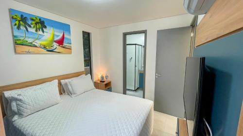 Katil atau katil-katil dalam bilik di Jardins Almare Apart Hotel