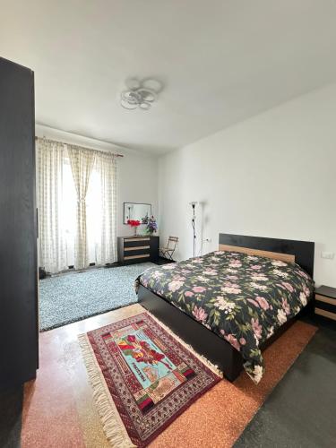 a bedroom with a bed and a rug at Casa Bella in Genova