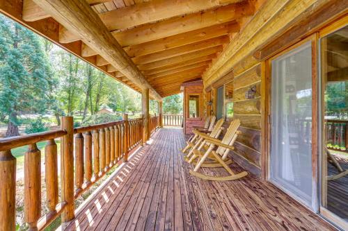 a porch of a cabin with rocking chairs on it at Private Deck Dog-Friendly Arlington Cabin in Arlington