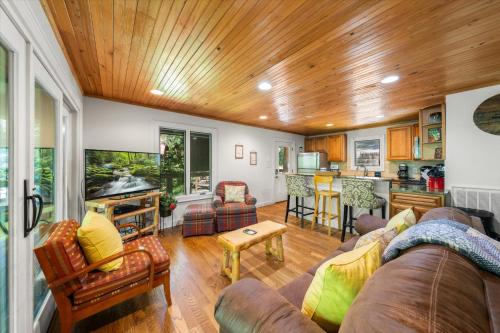 a living room with a couch and a kitchen at On The Rocks in Sevierville