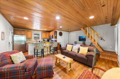 a living room with a couch and a kitchen at On The Rocks in Sevierville