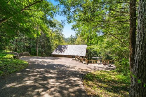 a path leading to a building in the woods at On The Rocks in Sevierville
