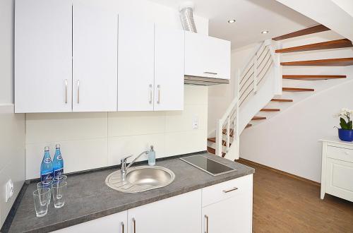 Η κουζίνα ή μικρή κουζίνα στο Apartamenty Mariner